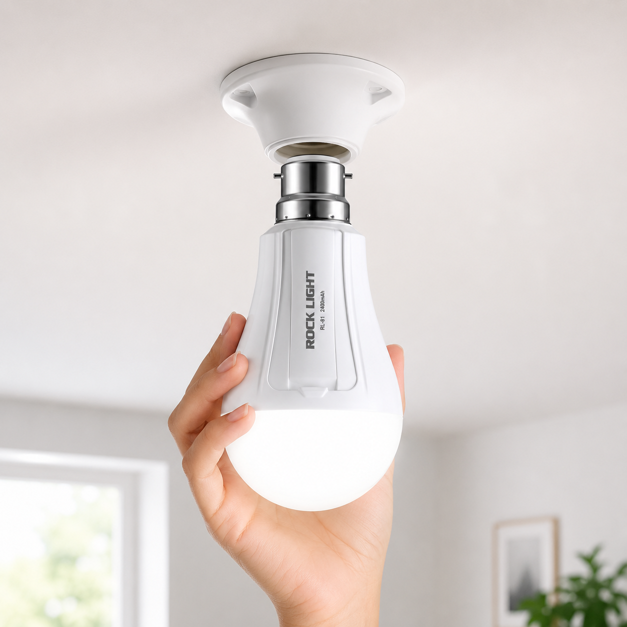 Rechargeable LED emergency bulb installed in a B22 ceiling holder, providing bright illumination during a power outage with built-in battery backup for home use.