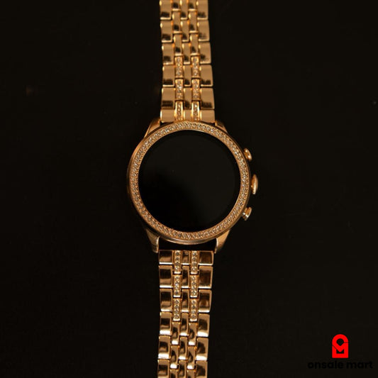 Gen 9 Smart Watch with golden metal strap and digital display for women.