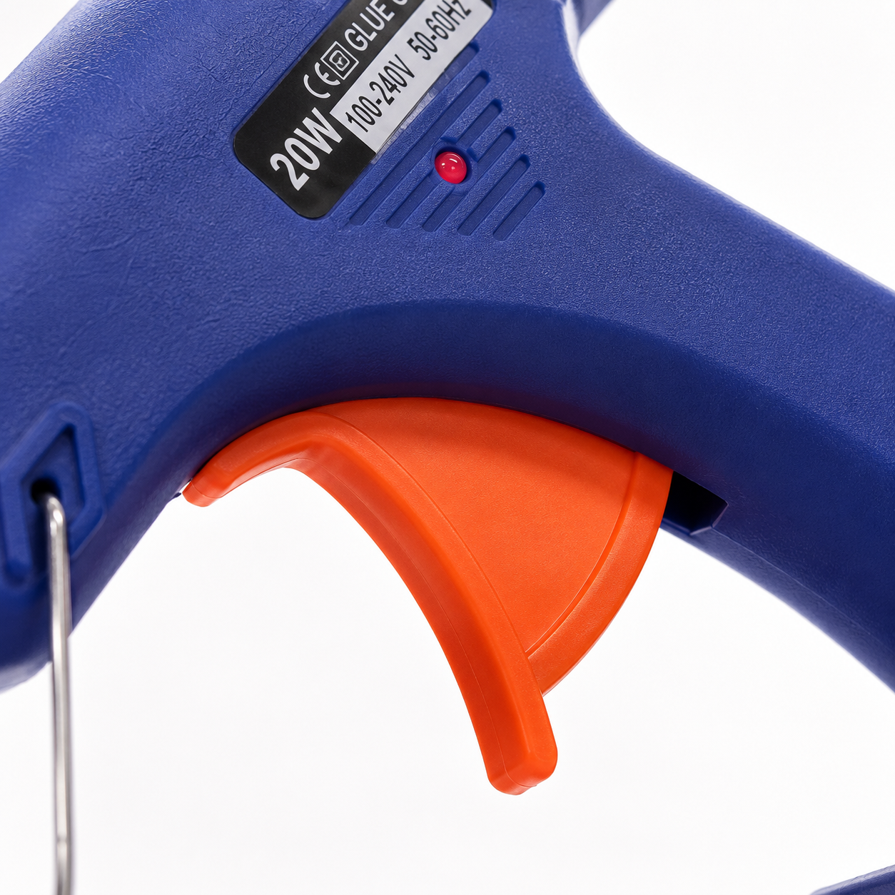 Close-up of a 20W mini hot melt glue gun featuring an ergonomic trigger, LED power indicator and heat-resistant body for precise crafting and DIY repairs.