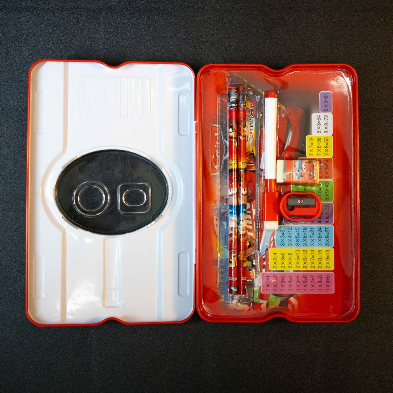 Kids Racing Car Stationery Box with Pencil Set open view showing pencils eraser sharpener ruler and multiplication chart inside red school pencil case