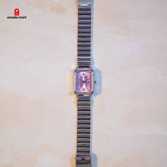 Rectangular steel watch with soft pink dial and crystal-style hour markers.