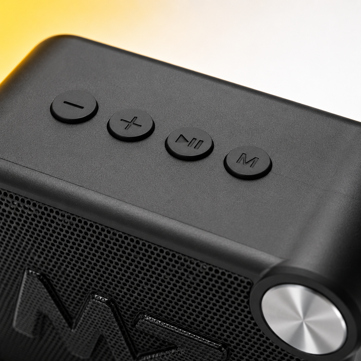 Detailed close-up of the portable Bluetooth speaker's top control panel featuring volume controls, play/pause button, mode button and durable tactile buttons for easy music and playback control.