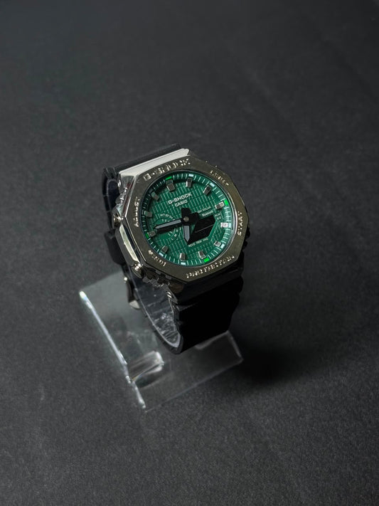 Green dial replica watch featuring octagonal stainless steel style bezel, black strap and luxury sports watch design on display stand.