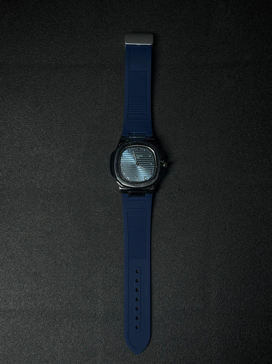 Blue strap replica watch featuring textured dial, luxury analog display, octagonal bezel design and premium silicone band