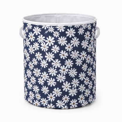 Blue floral round fabric laundry basket with white daisy pattern, ideal for clothes storage and home organisation.
