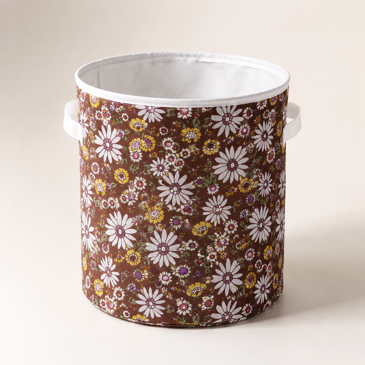 Round brown floral fabric laundry basket with handles for storing clothes, laundry, toys and household essentials.