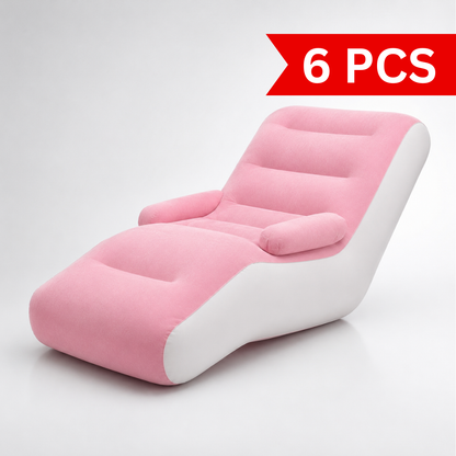 Pink and white single inflatable lounge sofa featuring an ergonomic reclining design, supportive backrest, side armrests, extended leg rest and thickened PVC construction for indoor use.