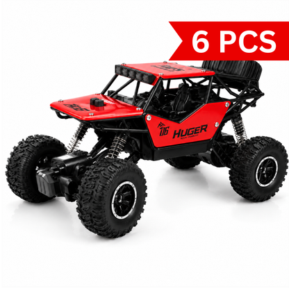 RC rock crawler with oversized off-road tyres and die-cast metal body.