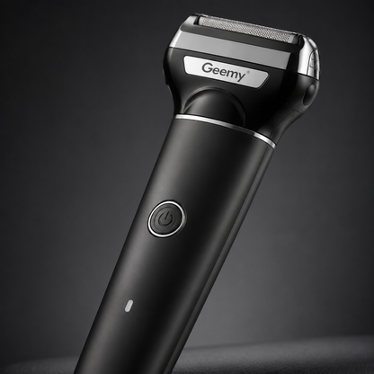 Close-up of a rechargeable electric foil shaver featuring a stainless steel shaving head, ergonomic matte black handle and one-touch power button