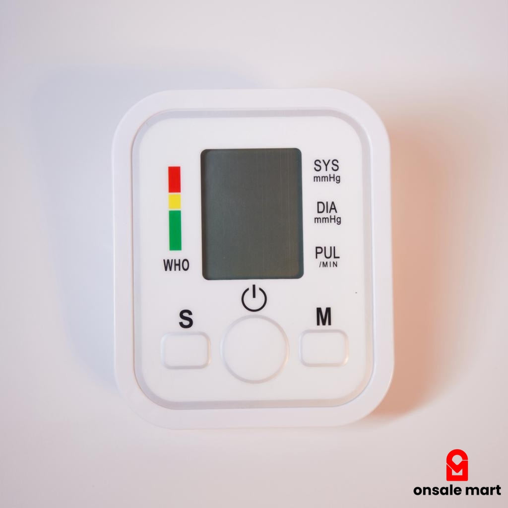 Close-up of digital BP monitor display with WHO indicator and control buttons.
