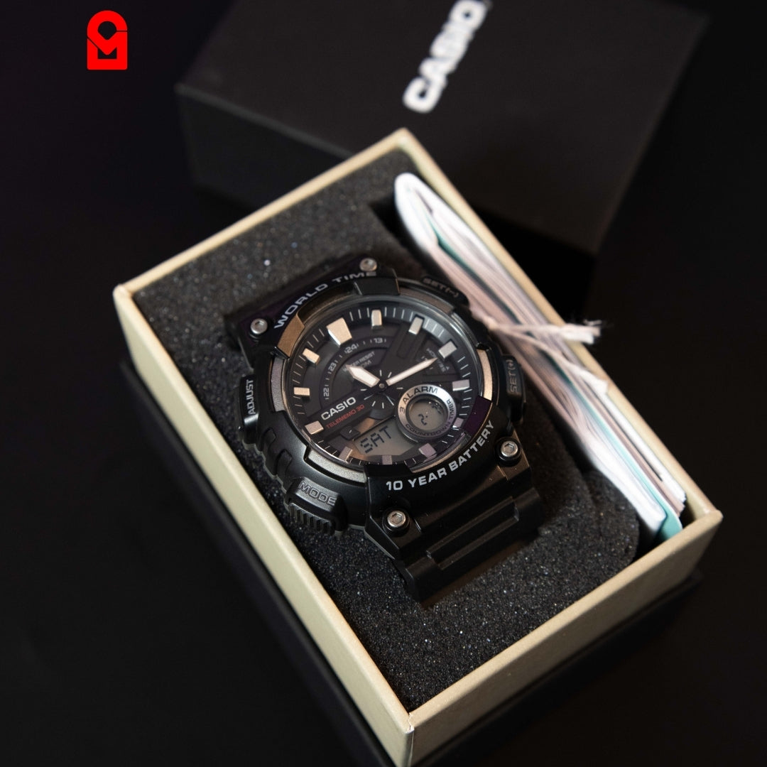 Analog digital world time watch with resin strap and multifunction dial shown in box packaging.