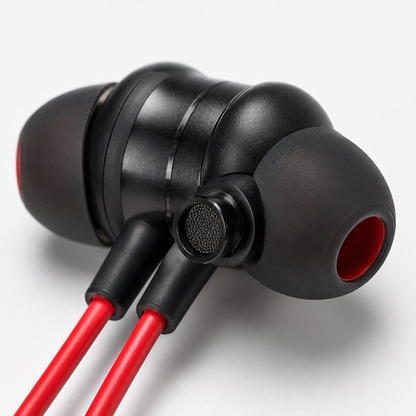 Close-up of a wireless Bluetooth earbud with soft silicone ear tip, built-in microphone mesh and ergonomic in-ear design for comfortable listening and clear calls.