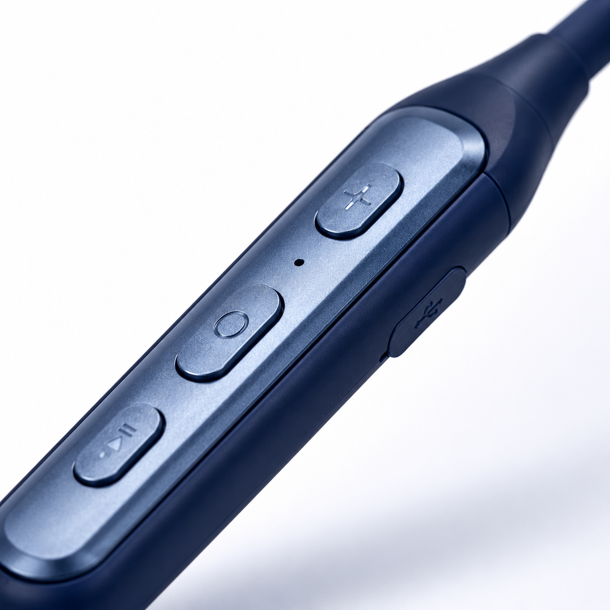 Detailed close-up of the wireless neckband control module featuring playback, power and volume buttons with USB Type-C charging port.