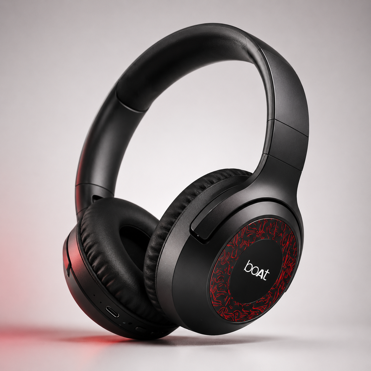 Premium black wireless over-ear Bluetooth headphones with soft cushioned ear pads, adjustable headband, built-in controls and foldable design, isolated