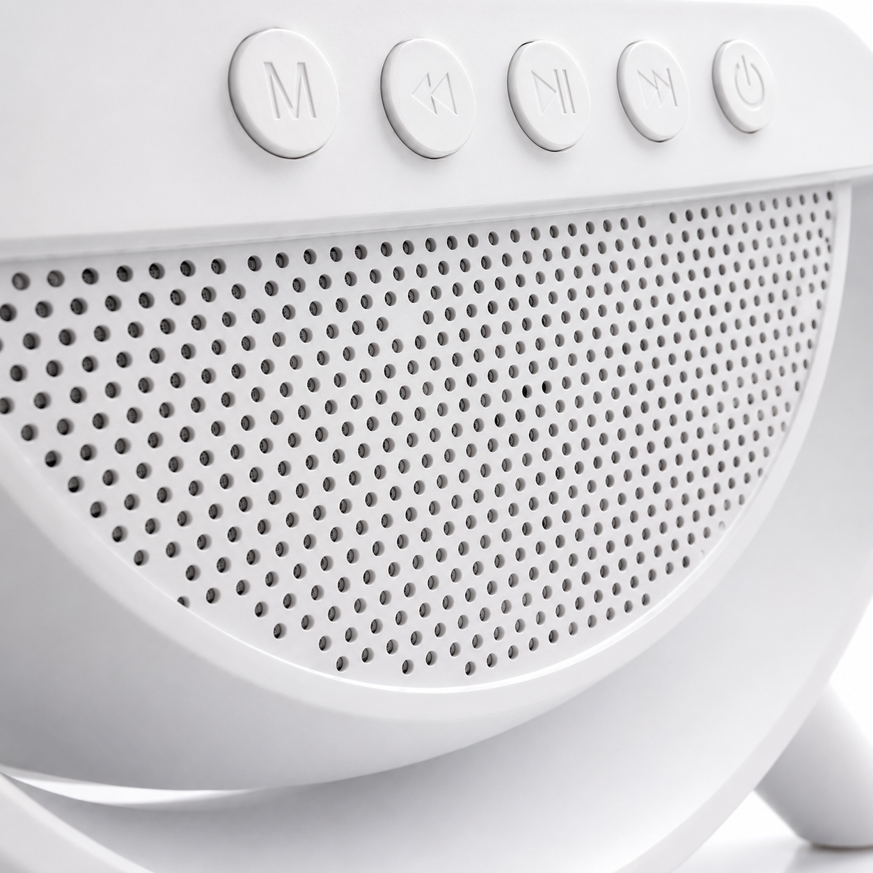 Macro close-up of the front speaker grille and multifunction control buttons on the LED wireless charging Bluetooth speaker with modern white minimalist design.