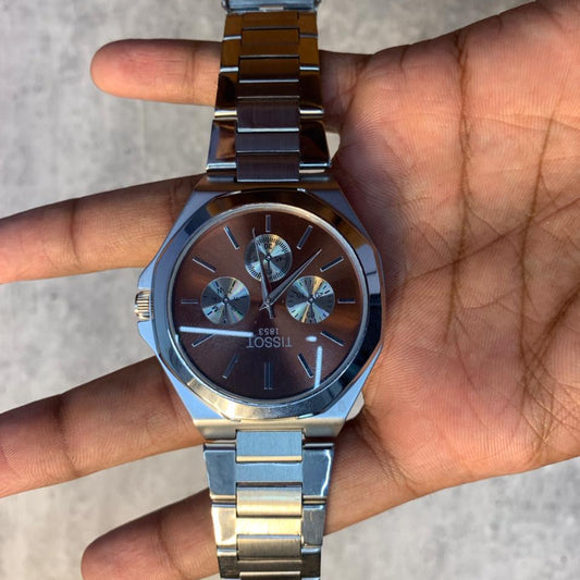 Brown Dial Steel Chronograph Watch with stainless steel bracelet and octagonal case on wrist.