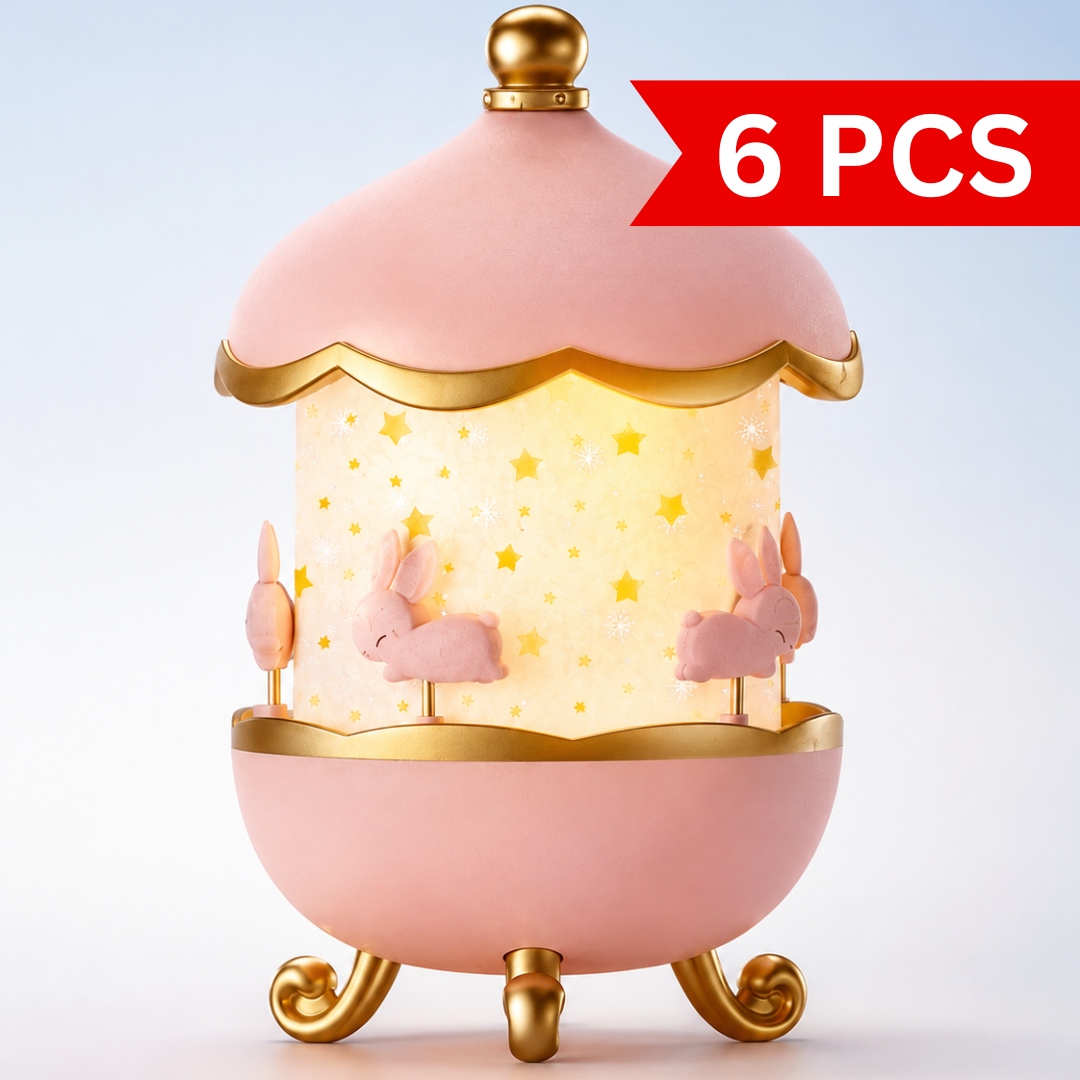 Bunny Carousel Music Night Lamp Projector in pink and gold finish with glowing star pattern shade and decorative bunny carousel design