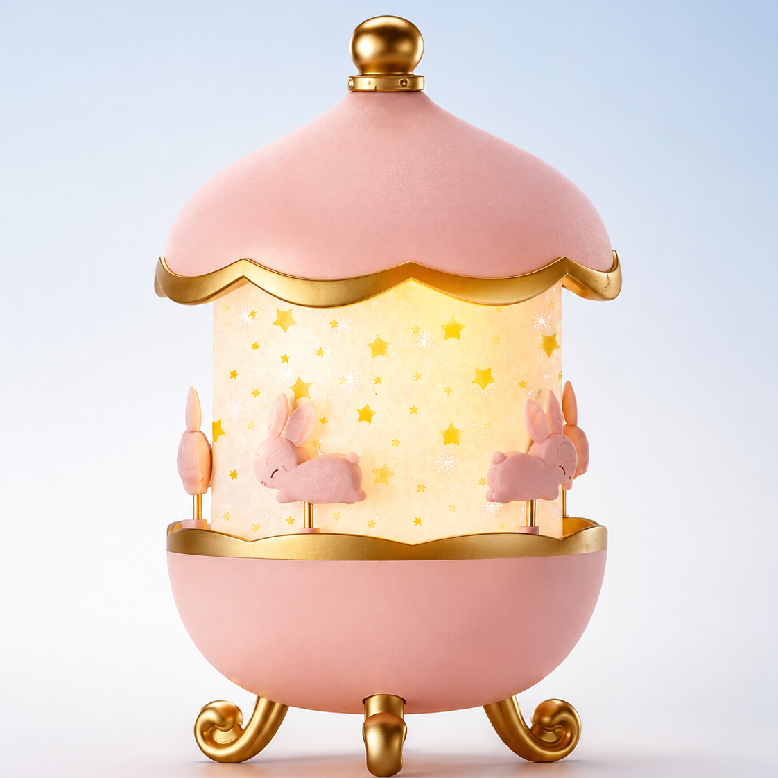 Bunny Carousel Music Night Lamp Projector in pink and gold finish with glowing star pattern shade and decorative bunny carousel design