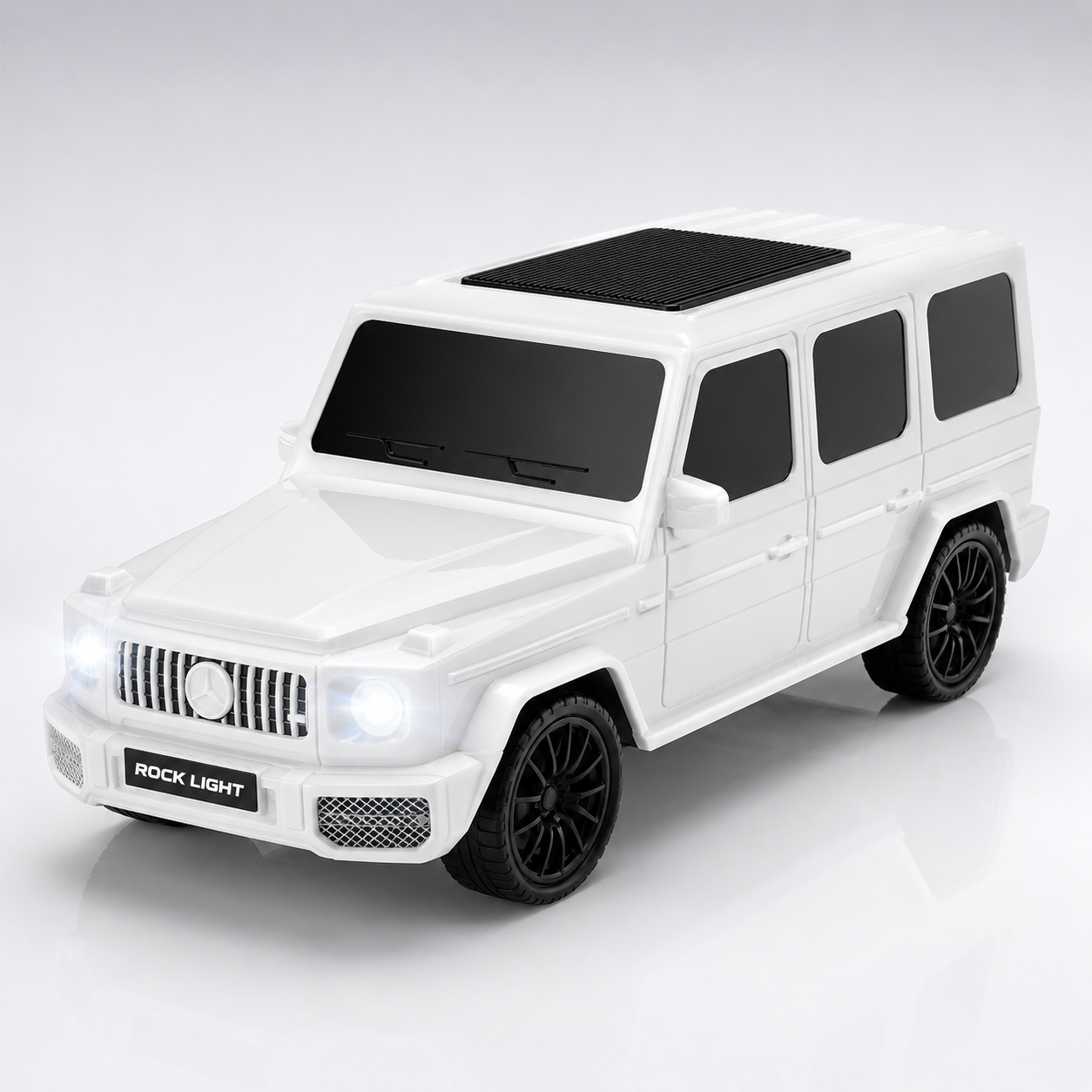 Glossy white SUV-inspired portable Bluetooth speaker with illuminated LED headlights and roof-mounted speaker grille on a premium studio background.