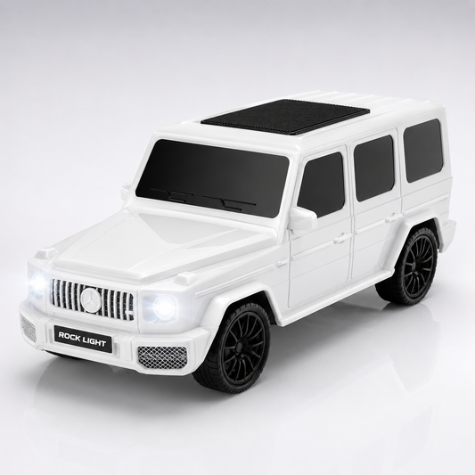 Glossy white SUV-inspired portable Bluetooth speaker with illuminated LED headlights and roof-mounted speaker grille on a premium studio background.