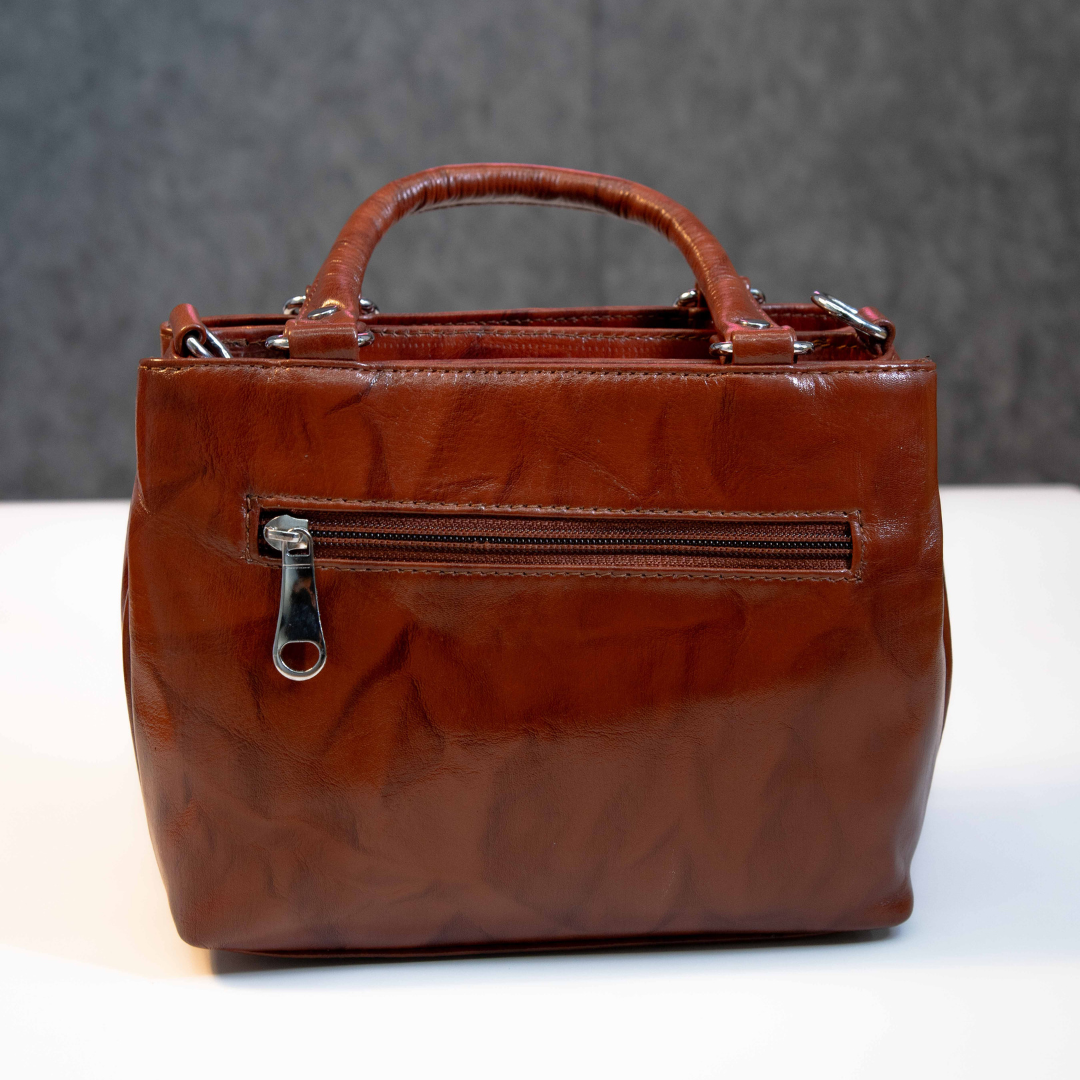 Classic brown leather tote bag with rear zip pocket for essentials.