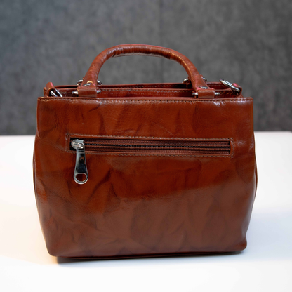Classic brown leather tote bag with rear zip pocket for essentials.