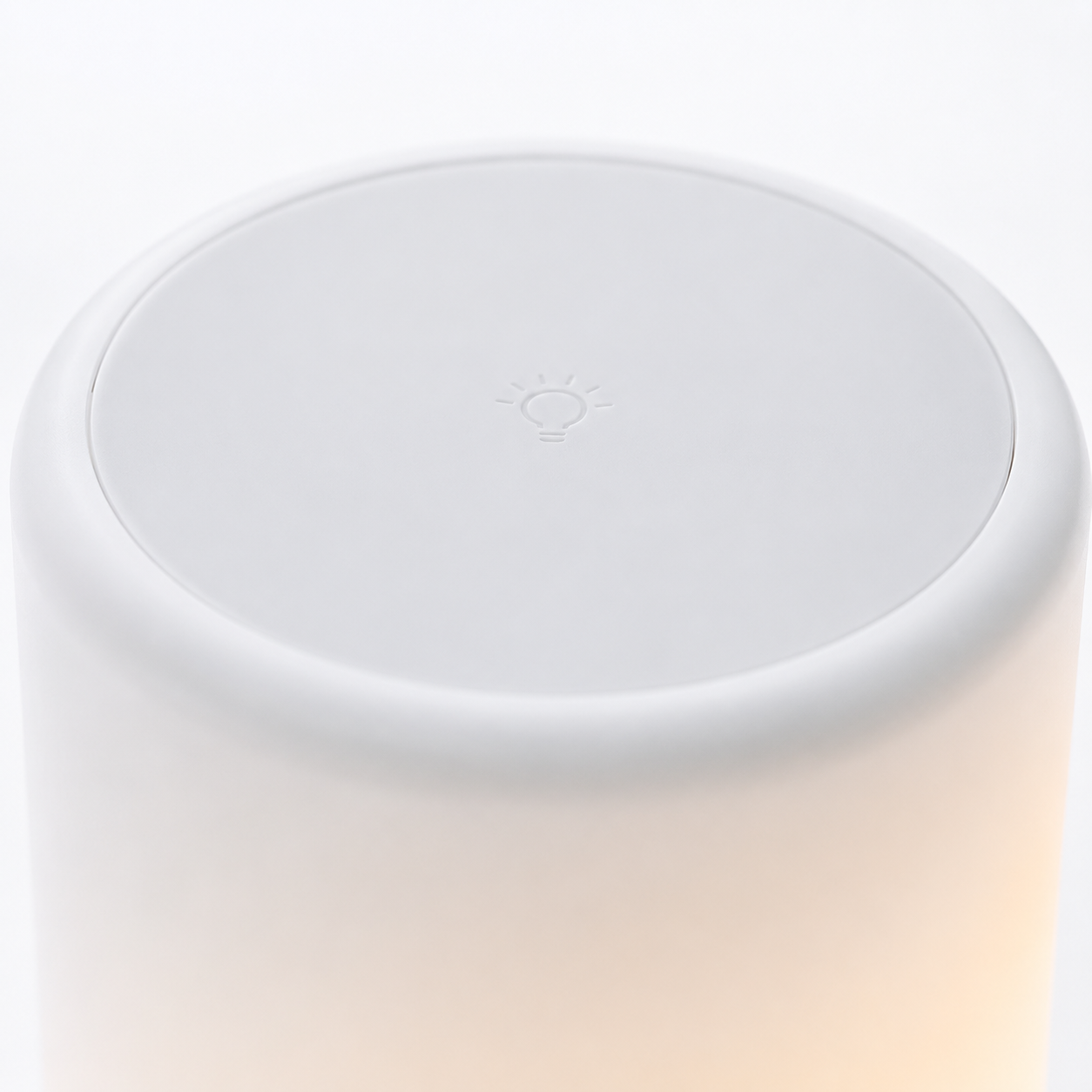 Close-up top view of the touch-sensitive control surface on the portable LED lamp speaker, designed for easy touch operation to adjust lighting modes and brightness.