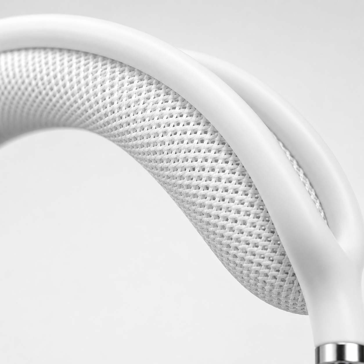 Extreme macro close-up of the breathable mesh canopy headband on premium white over-ear wireless Bluetooth headphones, highlighting the woven fabric texture, ergonomic cushioning, and high-quality craftsmanship.