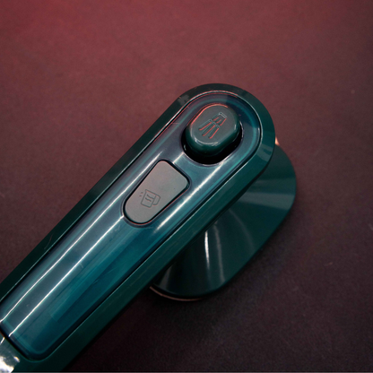 Top view of Compact Dry Iron with Mist Spray featuring ergonomic handheld controls and compact lightweight body