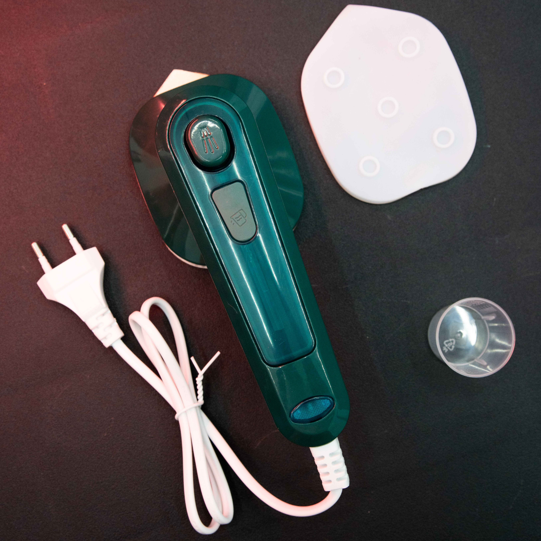 Compact Dry Iron with Mist Spray kit including measuring cup, resting pad, power cord and portable dry ironing design