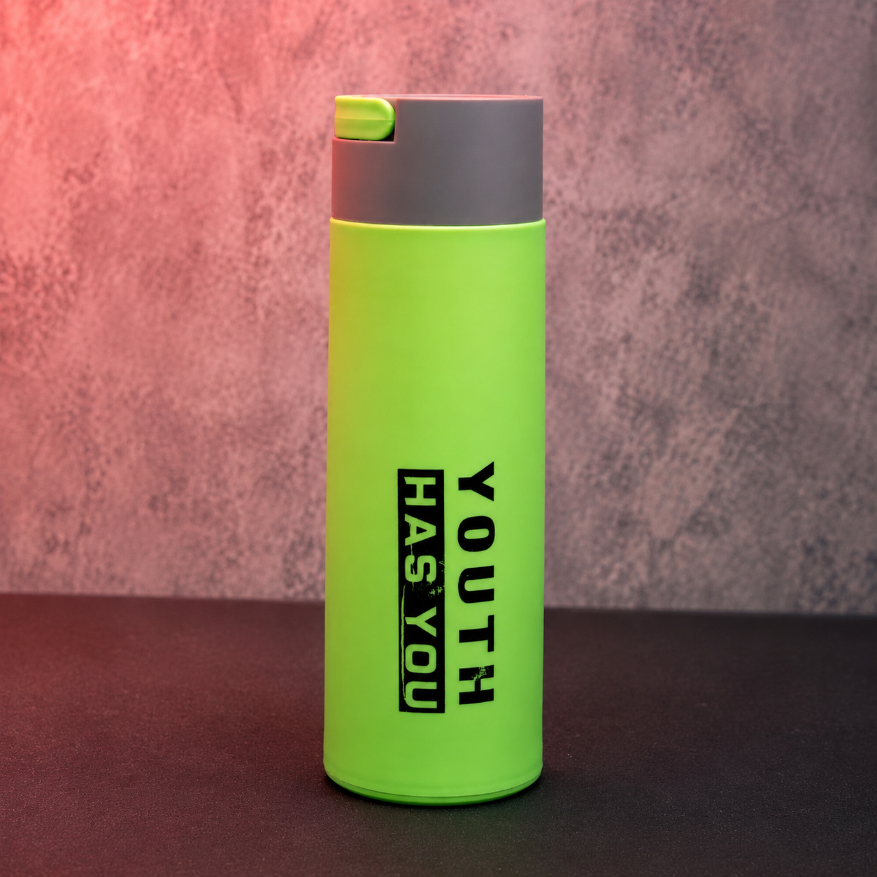 Green insulated water bottle with flip-top drinking lid and sleek cylindrical design for travel, office and outdoor use.