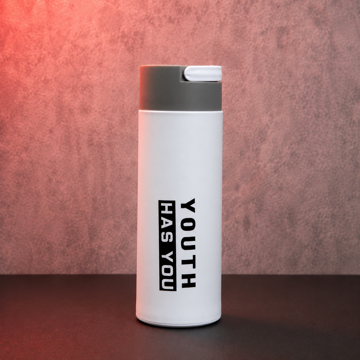 White insulated water bottle with flip-top cap, minimalist design and portable size for work, school and travel.