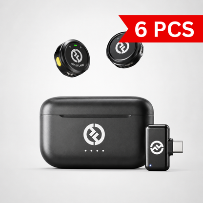 Compact wireless lavalier microphone system featuring two button-sized transmitters, USB-C receiver adapter, and portable charging case displayed