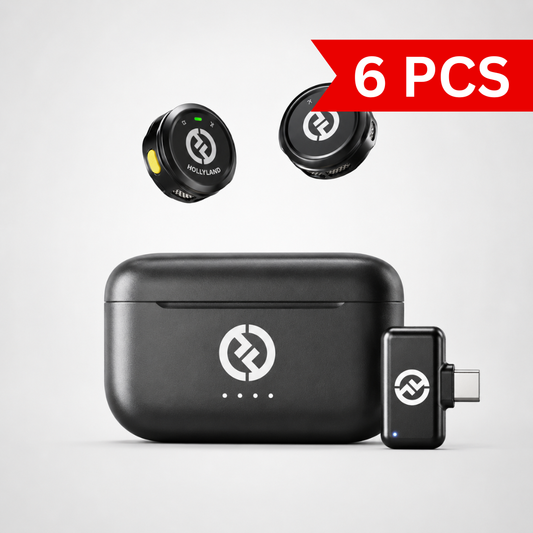 Compact wireless lavalier microphone system featuring two button-sized transmitters, USB-C receiver adapter, and portable charging case displayed