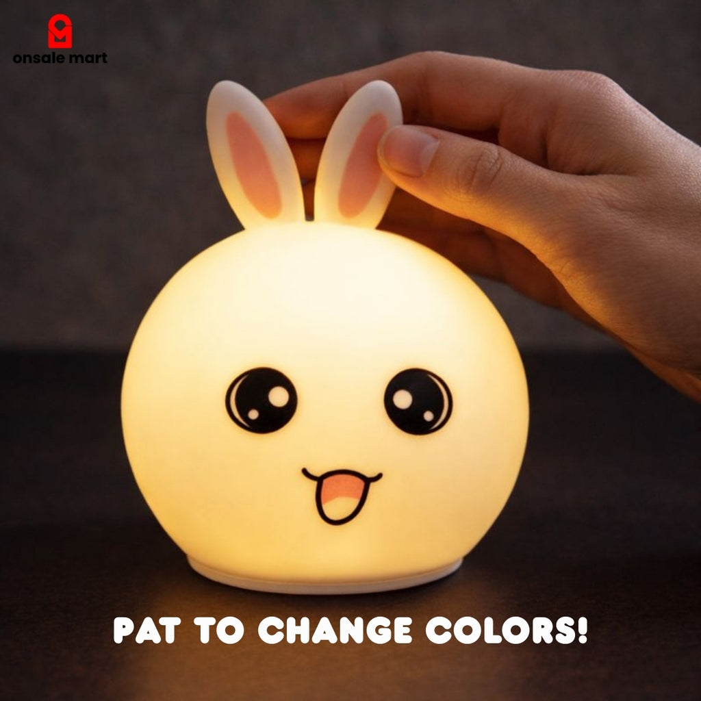 Cute Bunny Night Light silicone color changing rabbit lamp being patted to change LED colors.
