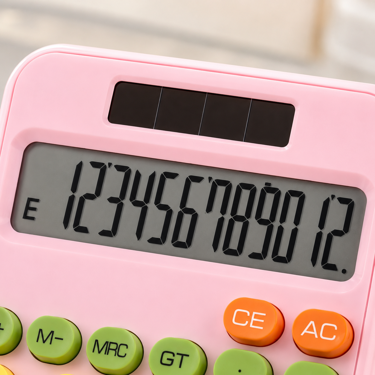 Close-up of pastel pink calculator featuring a large easy-to-read LCD screen, solar panel, and colourful function keys for everyday calculations.