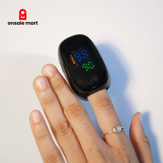Digital pulse oximeter worn on finger displaying oxygen saturation and heart rate.