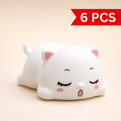 Cute sleeping cat silicone night lamp with soft white body, pink ears and peaceful sleeping expression, ideal for bedside décor and kids room lighting.