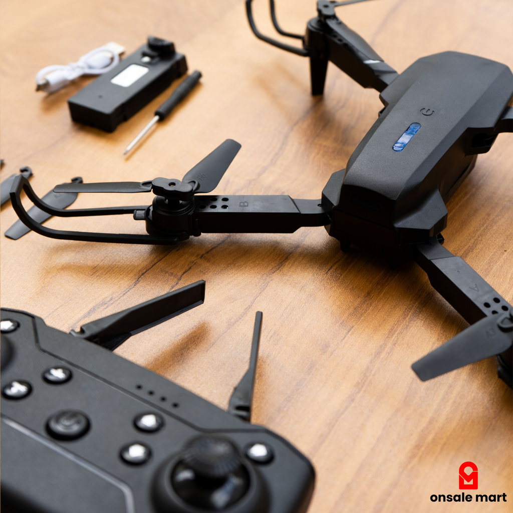 Mini Drone with remote control on a wooden surface, featuring Onsale Mart logo.