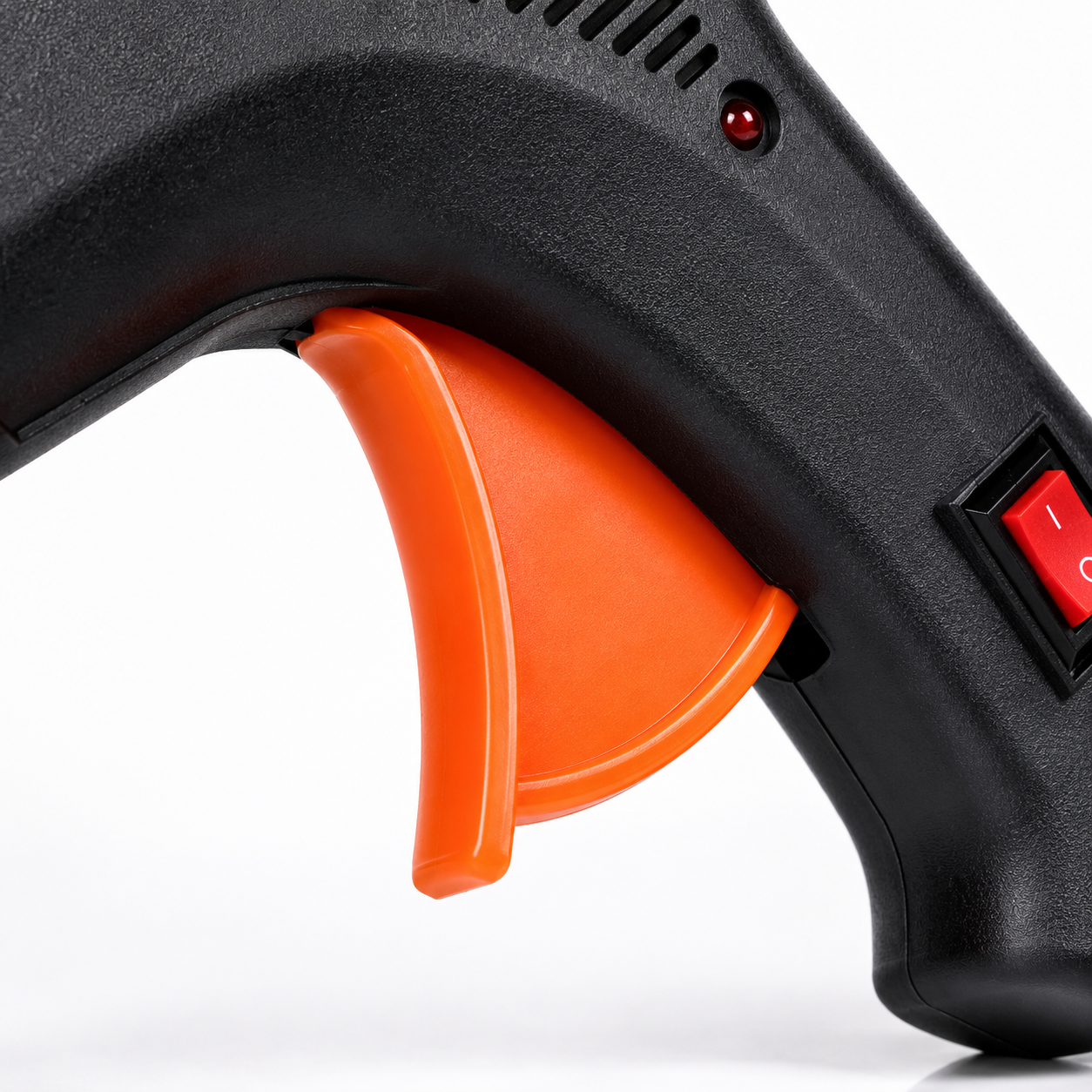 Close-up of the ergonomic trigger on a 100W hot melt glue gun, designed for smooth glue flow and comfortable control during crafts and repair work.