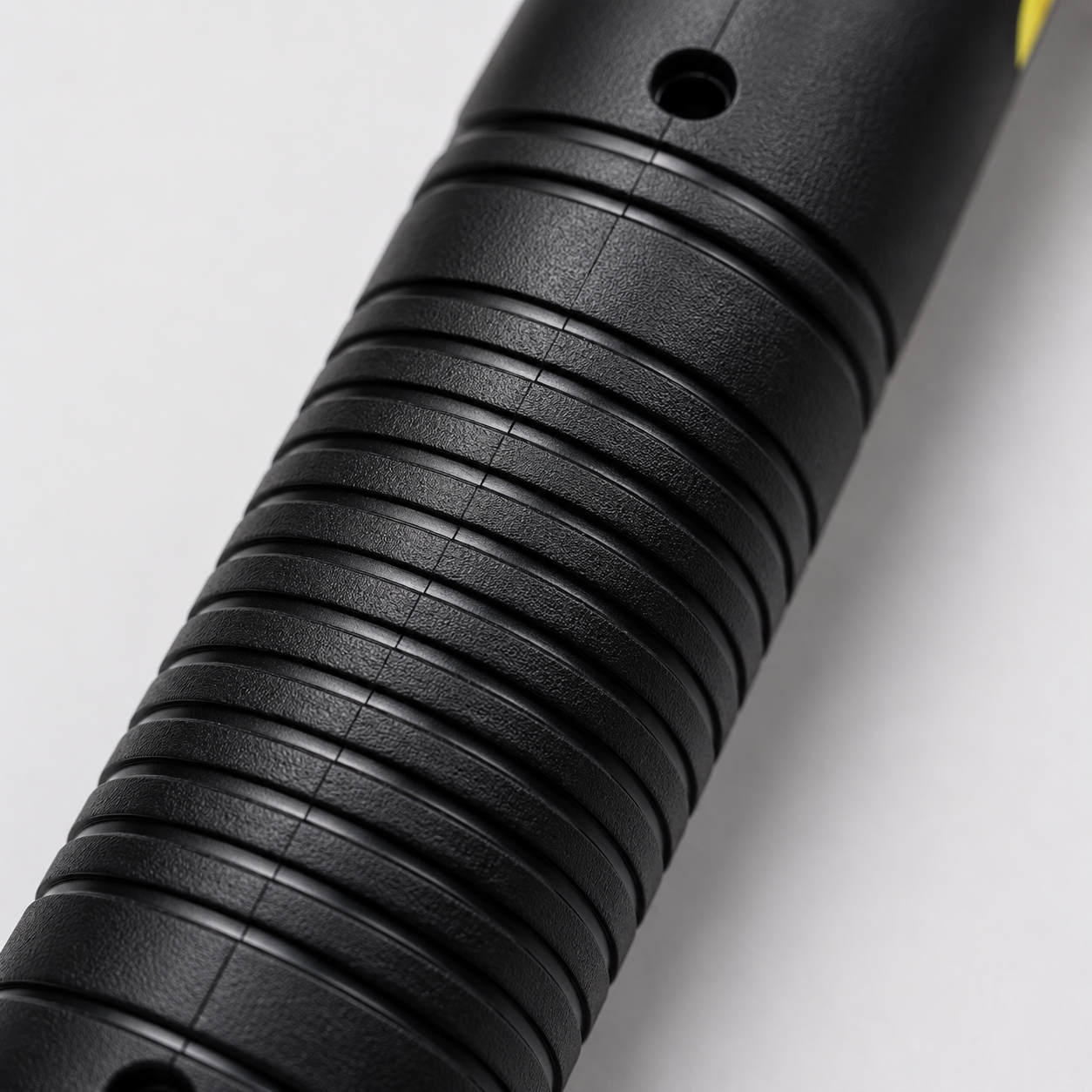 Close-up of ergonomic textured handle on rechargeable electric mosquito bat with non-slip grip design for comfortable use