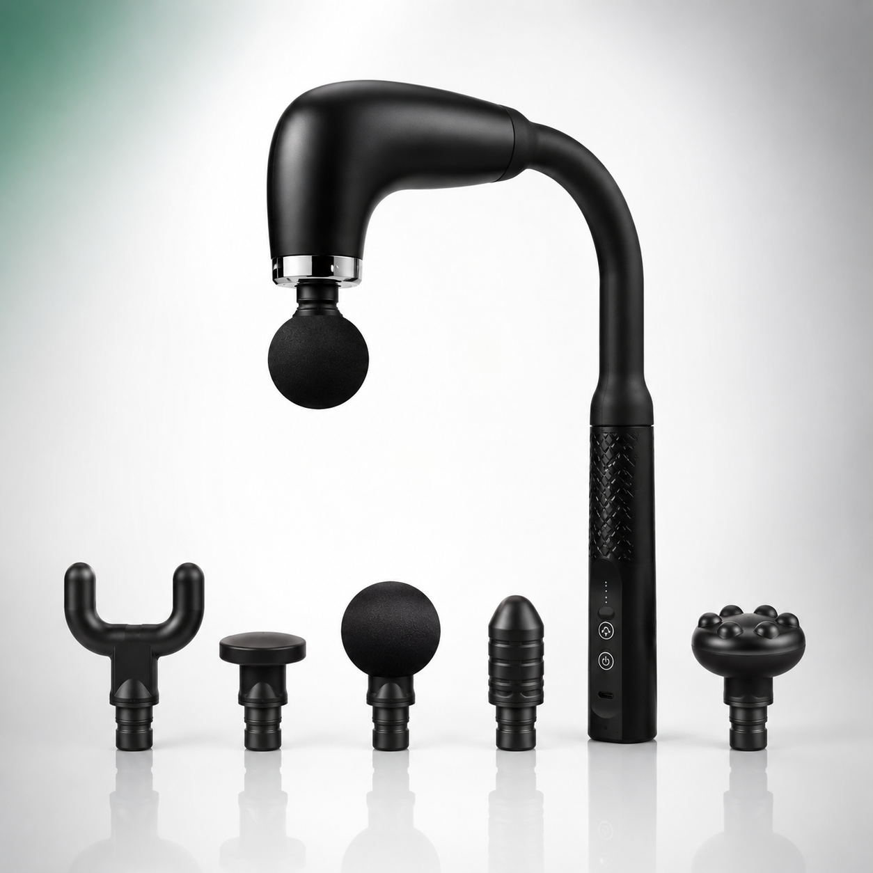 Rechargeable deep tissue massage gun with ergonomic long-reach handle displayed alongside five interchangeable massage heads, including round, flat, bullet, U-shaped, and multi-point attachments