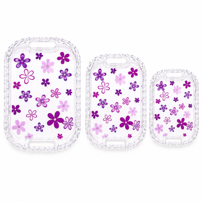 3-piece floral serving tray set with transparent crystal-look braided border, built-in handles, and purple flower design in large, medium, and small sizes on a white background.