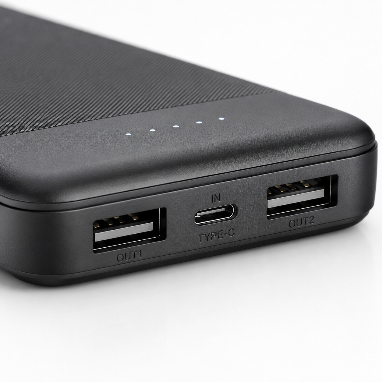 Close-up of the power bank showing dual USB output ports, USB Type-C input port and four LED battery level indicators for convenient charging and status monitoring.