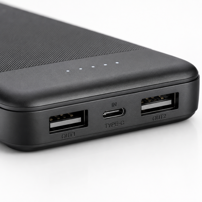 Close-up of the power bank showing dual USB output ports, USB Type-C input port and four LED battery level indicators for convenient charging and status monitoring.