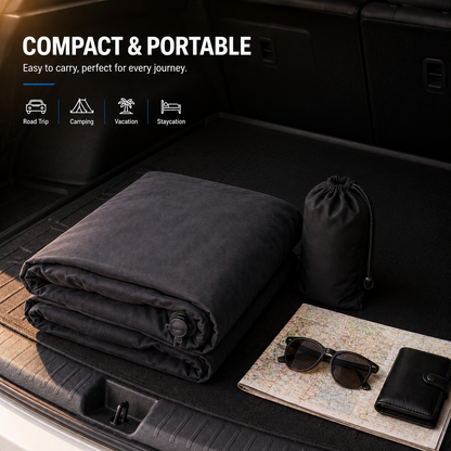Folded inflatable car mattress with storage bag placed in a vehicle trunk, highlighting its compact and portable design for travel and camping.