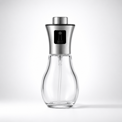 Glass Cooking Oil Mister Bottle with stainless steel spray head, empty transparent glass container, reusable kitchen oil sprayer dispenser isolated on white background.
