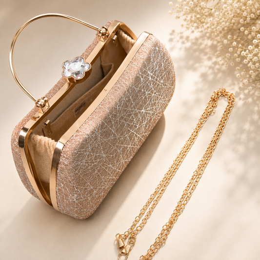 Open rose gold evening clutch bag showing fabric-lined interior and detachable chain strap, elegant glitter finish with crystal flower lock.