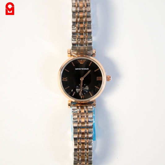 Gold and black automatic luxury watch for women with stainless steel bracelet on white background.