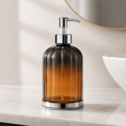 Hand Wash Storage Dispenser Bottle with amber transparent body and chrome pump displayed on luxury bathroom vanity countertop